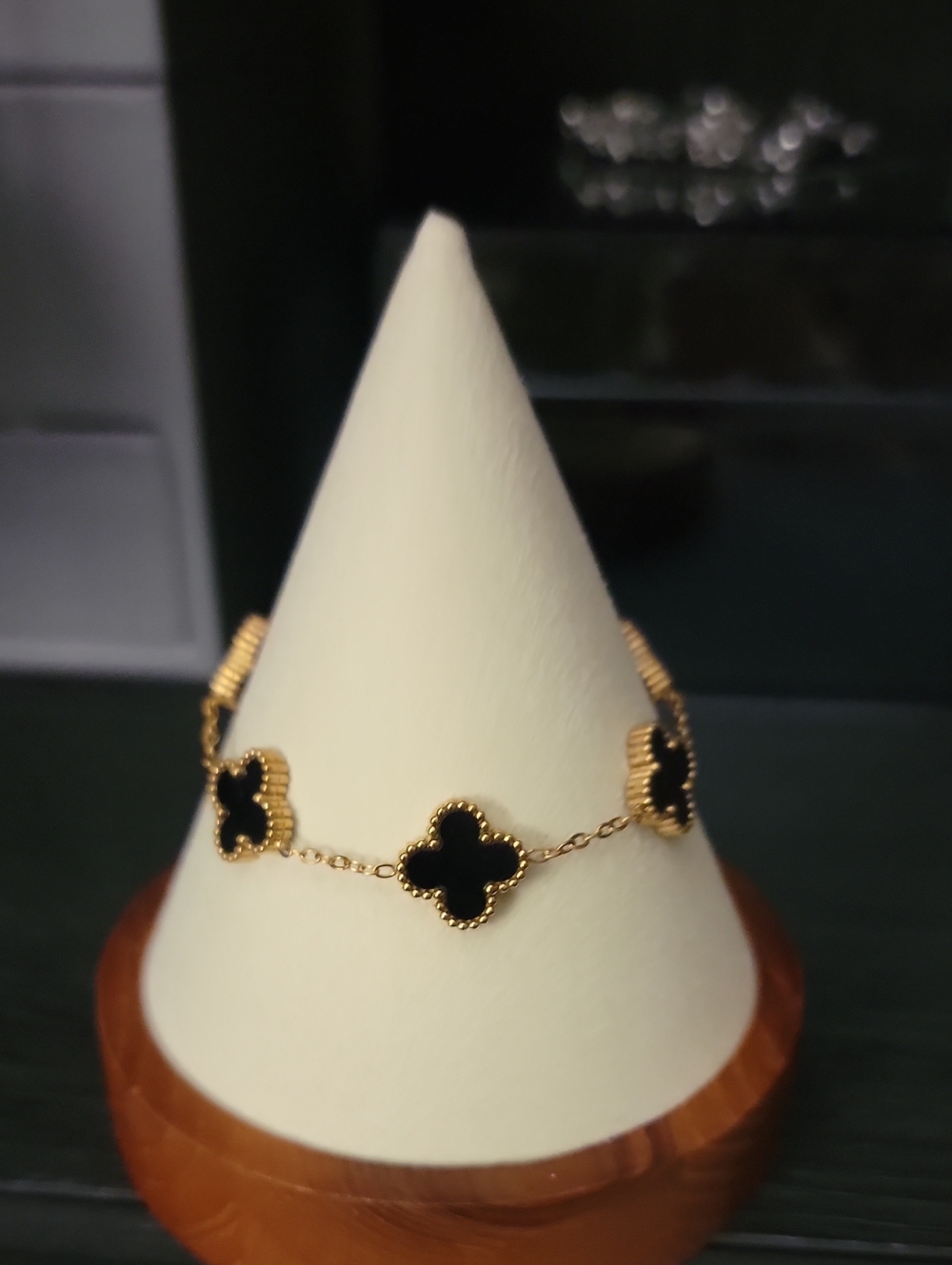 Gold Tone Bracelet with Black Clover Motifs